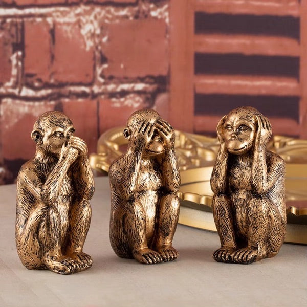 Decoratief beeldje met Oosterse symboliek van de drie wijze aapjes in goudkleur.