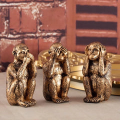 Decoratief beeldje met Oosterse symboliek van de drie wijze aapjes in goudkleur.